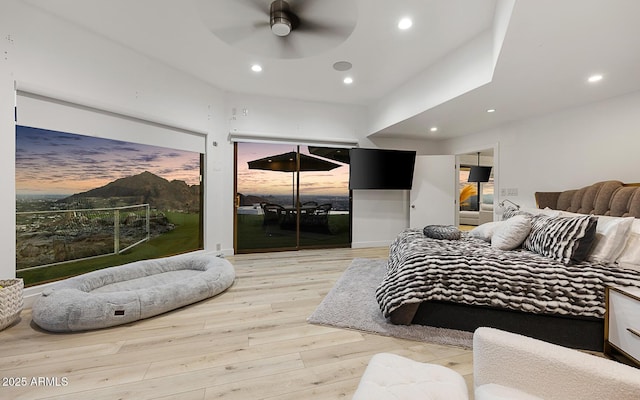 bedroom with ceiling fan and light wood-type flooring