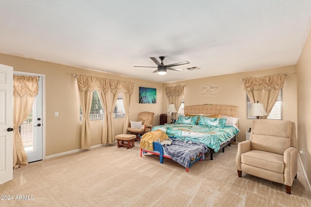 bedroom with visible vents, a ceiling fan, carpet flooring, access to outside, and baseboards