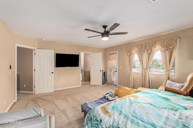 bedroom featuring baseboards, a ceiling fan, and light colored carpet