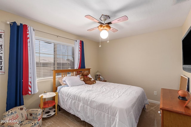 carpeted bedroom featuring a ceiling fan and baseboards