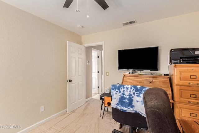 interior space featuring light carpet, baseboards, visible vents, and a ceiling fan