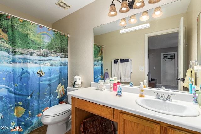 bathroom featuring toilet, a shower with shower curtain, vanity, and visible vents