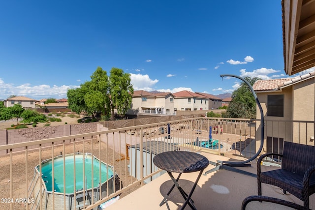 view of patio / terrace with a balcony and a residential view