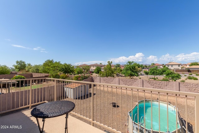 balcony featuring a residential view and a jacuzzi