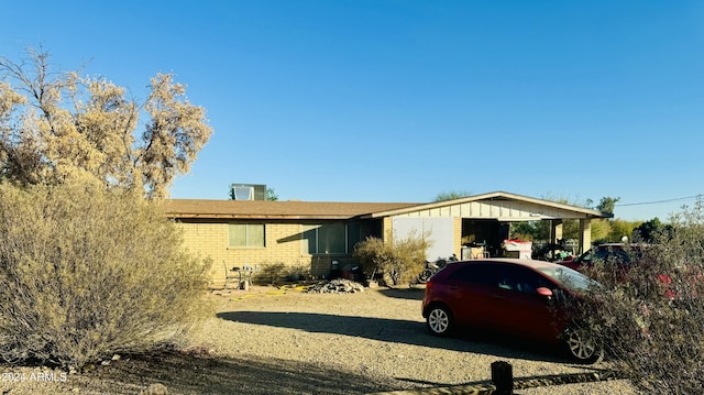 view of front of home with a carport