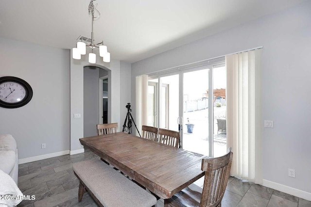 dining room with a notable chandelier