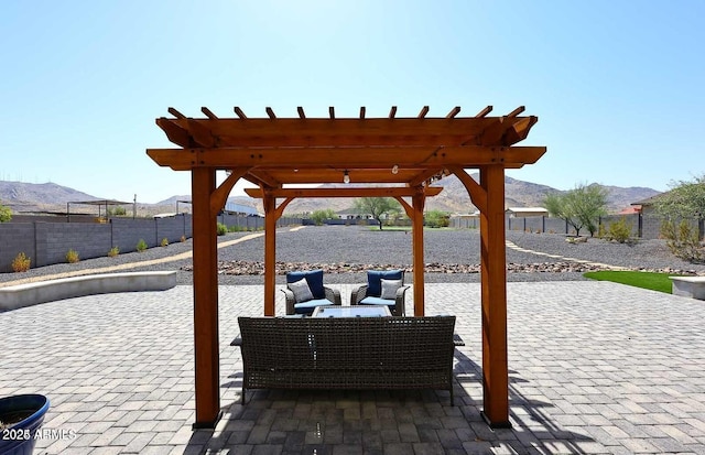 view of patio with a pergola, a mountain view, and an outdoor hangout area