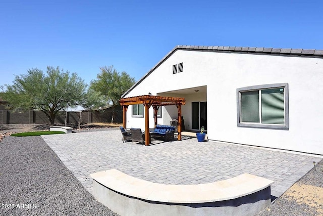 rear view of property with a pergola, an outdoor living space, and a patio