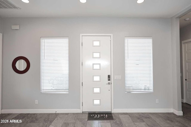 entrance foyer featuring plenty of natural light