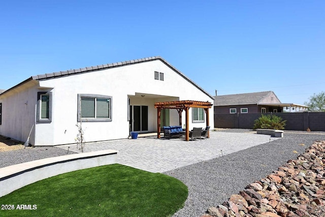 rear view of property featuring a patio area and a pergola