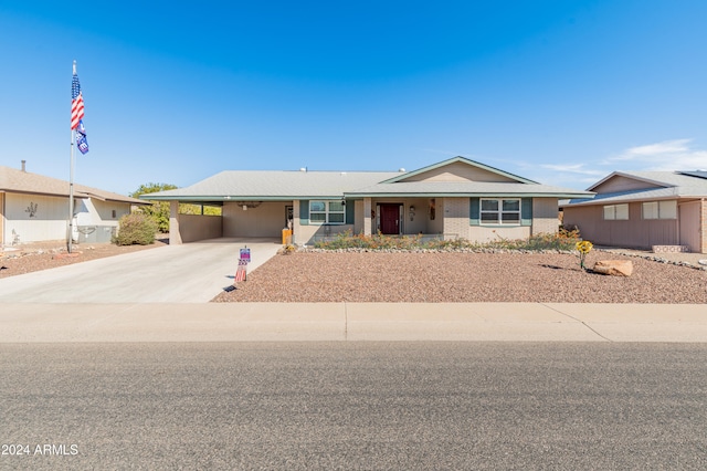 ranch-style home with a carport