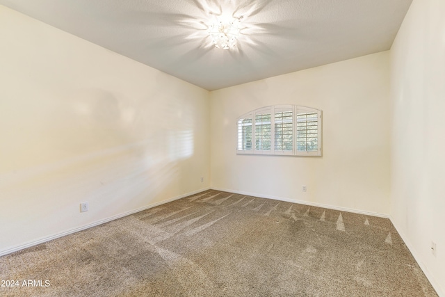 unfurnished room with carpet