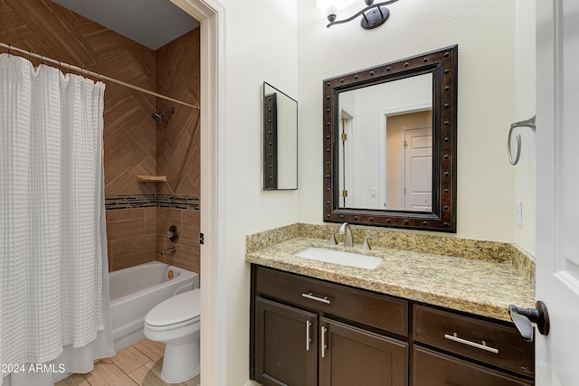 full bathroom featuring shower / bath combo, toilet, and vanity