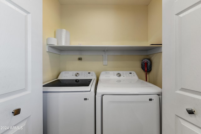 washroom featuring washer and clothes dryer