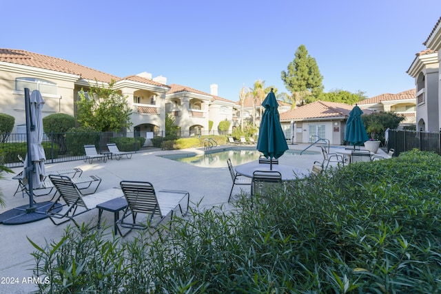 view of swimming pool featuring a patio area