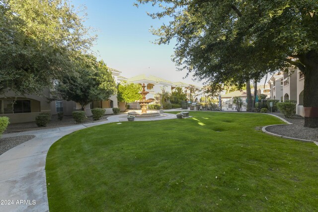8653 E Royal Palm Rd Unit 2005, Scottsdale, AZ 85258 - view of asphalt road with a gate, a gated entry, and curbs