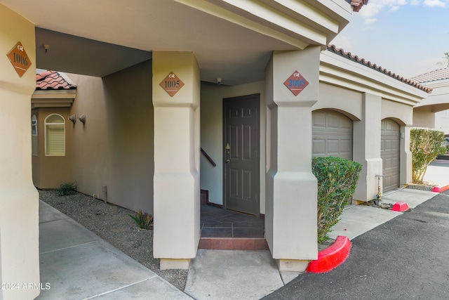 entrance to property featuring a garage