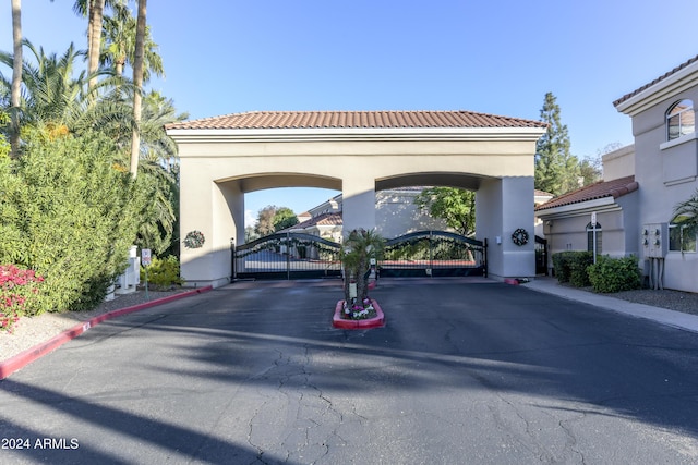 8653 E Royal Palm Rd Unit 2005, Scottsdale, AZ 85258 - view of asphalt street featuring a gate, a gated entry, and curbs
