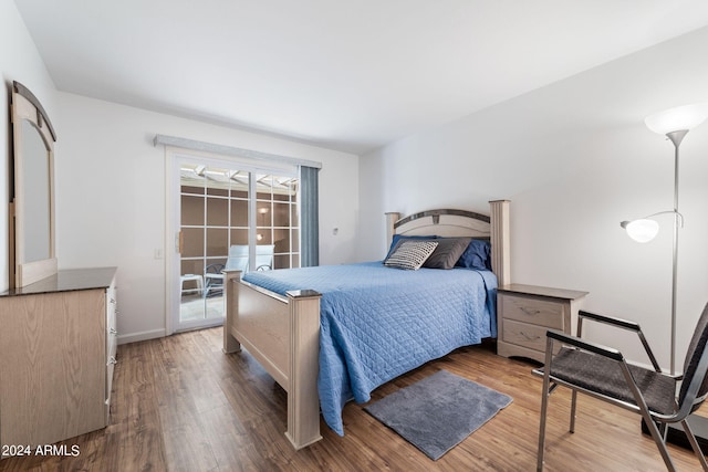 bedroom with hardwood / wood-style floors