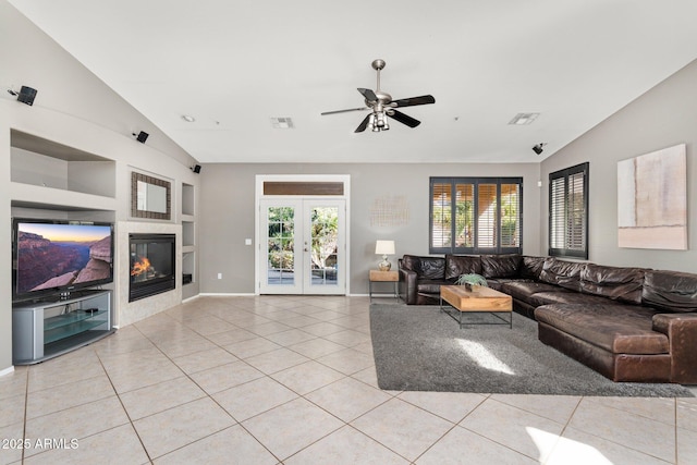 living room with light tile patterned floors, visible vents, and french doors