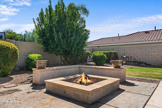 view of patio / terrace with an outdoor fire pit