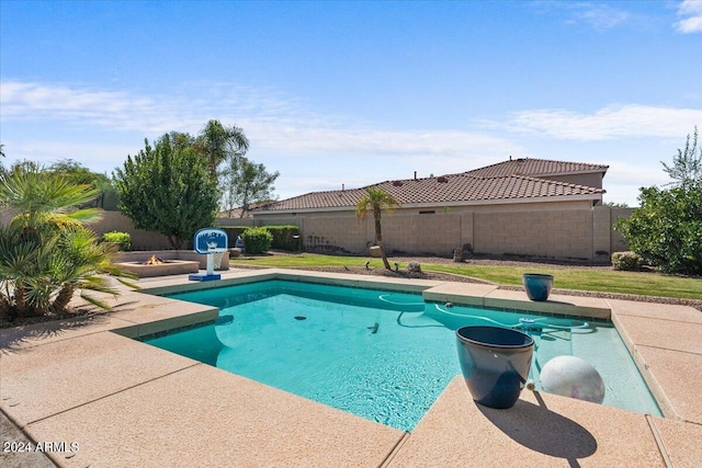 view of pool with a yard