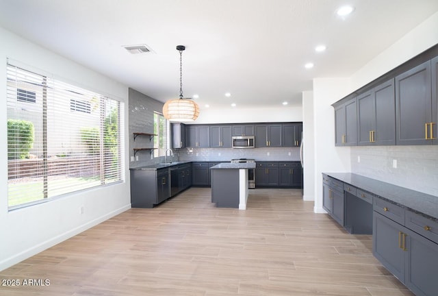6014 W Oberlin Way, Phoenix, AZ 85083 - kitchen featuring stainless steel appliances, recessed lighting, a kitchen island, backsplash, and pendant lighting