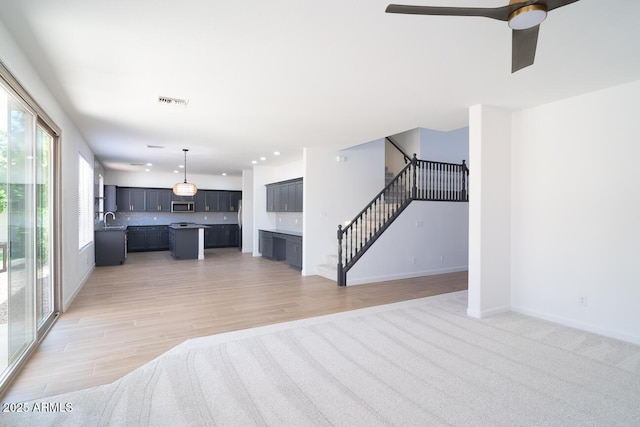 6014 W Oberlin Way, Phoenix, AZ 85083 - unfurnished living room featuring stairway, light wood-style flooring, recessed lighting, and a ceiling fan