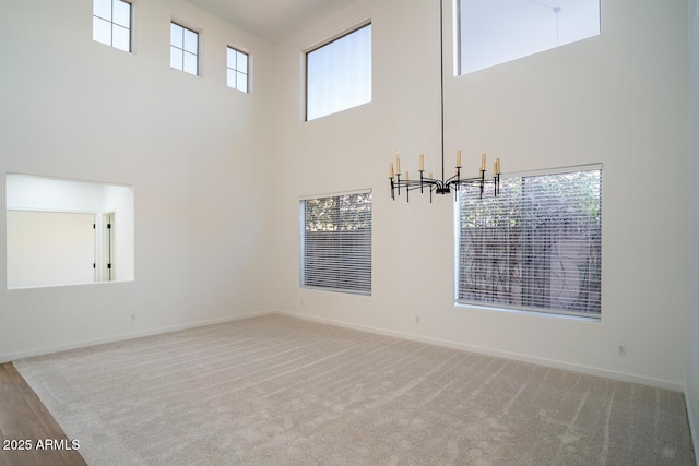 6014 W Oberlin Way, Phoenix, AZ 85083 - carpeted spare room with a high ceiling and a chandelier