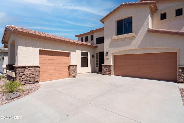 6014 W Oberlin Way, Phoenix, AZ 85083 - mediterranean / spanish-style home featuring stone siding, a tile roof, and stucco siding