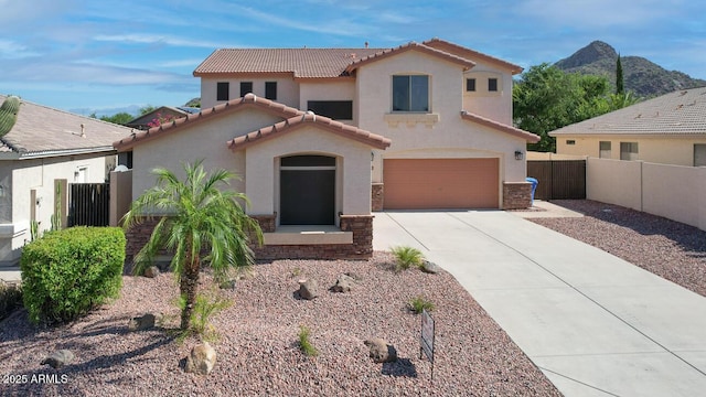 6014 W Oberlin Way, Phoenix, AZ 85083 - mediterranean / spanish-style home featuring stucco siding, concrete driveway, a tiled roof, and a garage