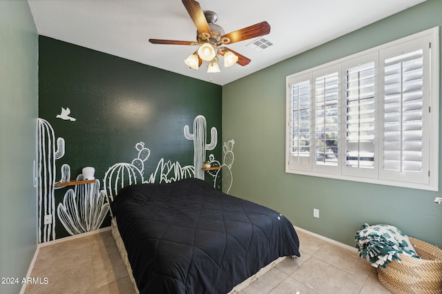 tiled bedroom with ceiling fan