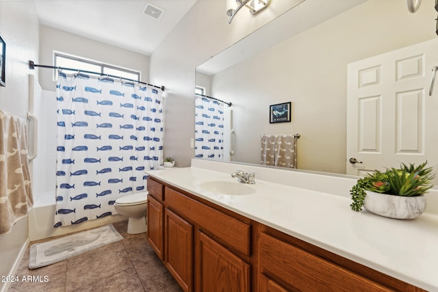 full bathroom featuring vanity, shower / bath combo, toilet, and tile patterned flooring