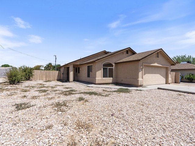 single story home with a garage