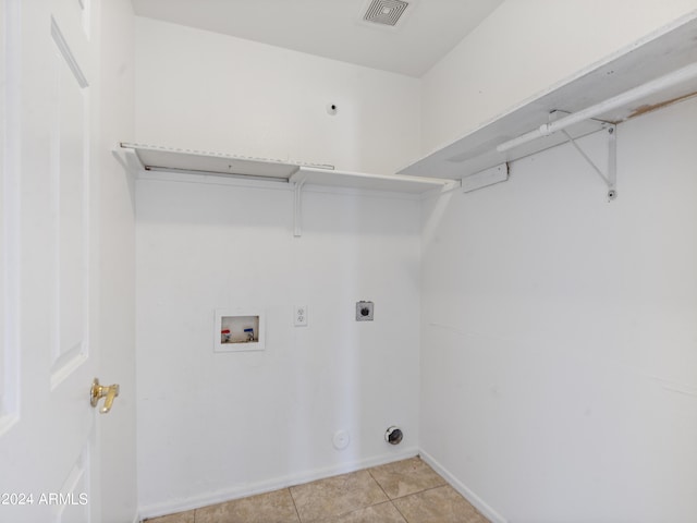 laundry room featuring light tile patterned flooring, electric dryer hookup, and washer hookup