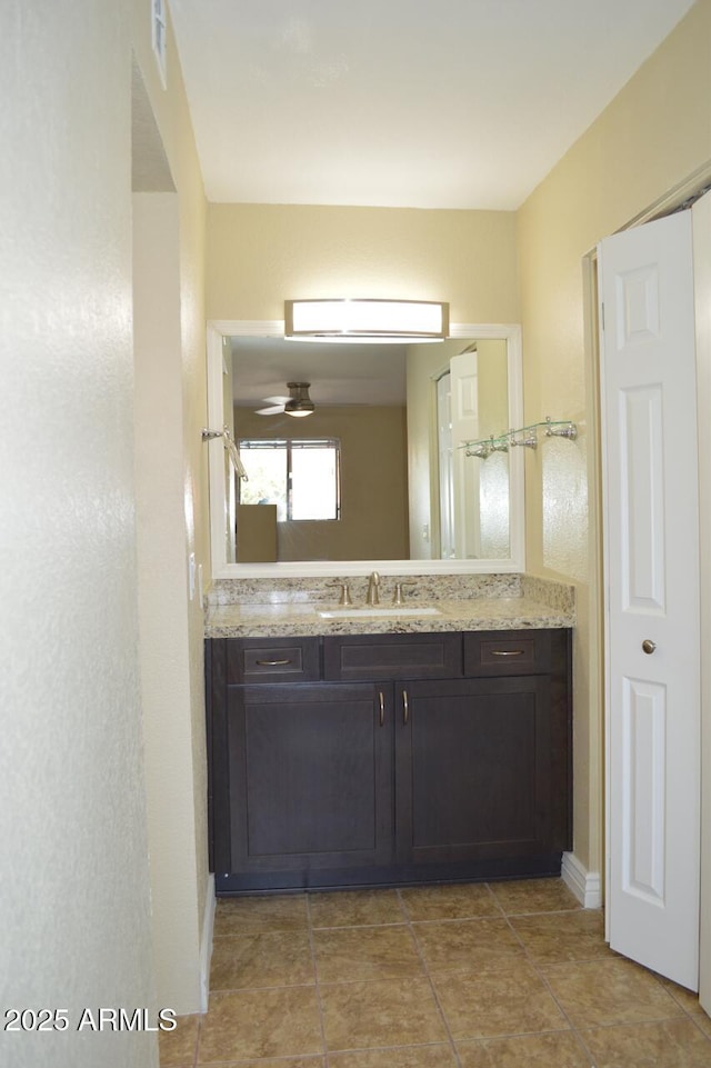 bathroom with tile patterned flooring, visible vents, and vanity