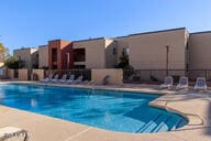 view of swimming pool with fence, a fenced in pool, and a patio