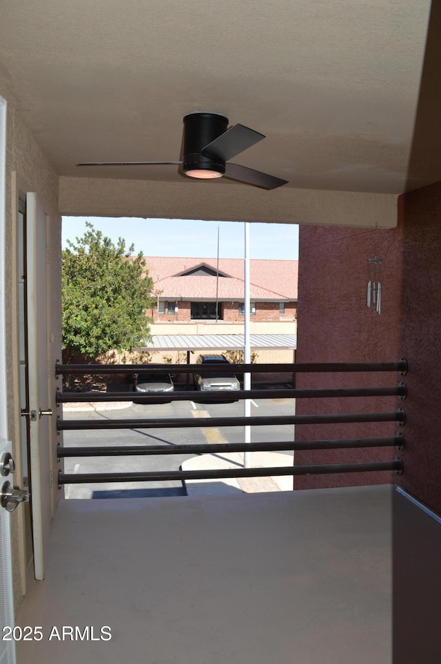 balcony featuring ceiling fan