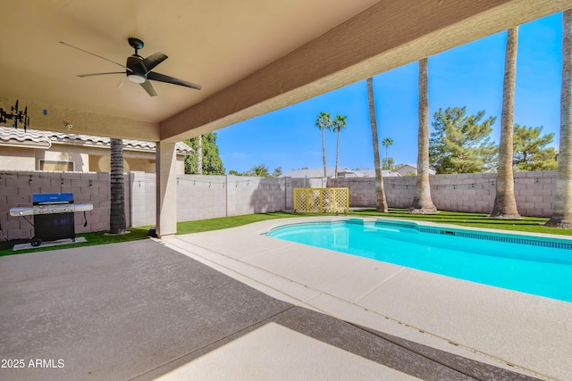 view of swimming pool with a patio, a fenced backyard, a ceiling fan, grilling area, and a fenced in pool