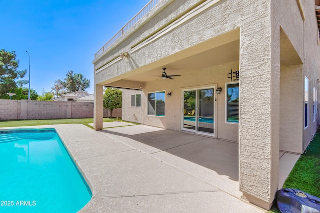 view of swimming pool featuring a patio area, a fenced backyard, a ceiling fan, and a fenced in pool