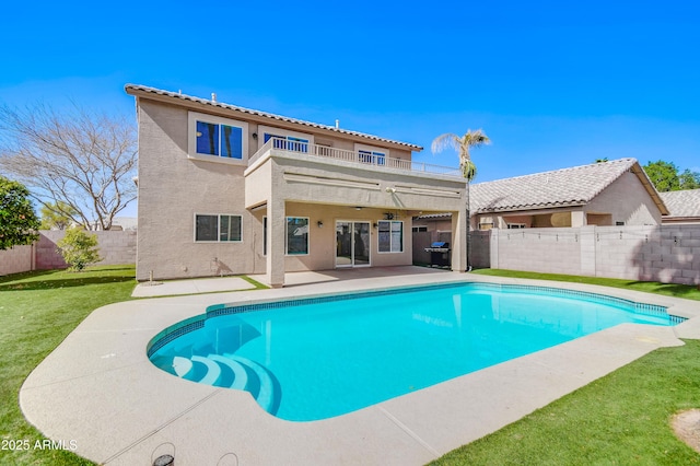 view of pool featuring a fenced in pool, a patio area, a fenced backyard, and a yard