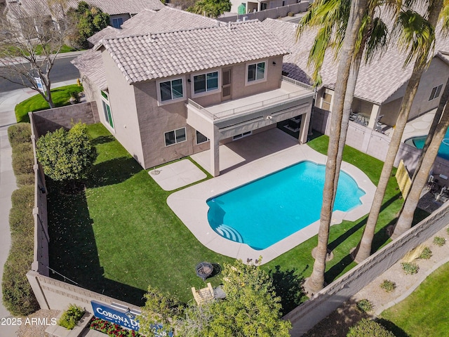 view of swimming pool featuring a yard, a patio area, a fenced backyard, and a fenced in pool