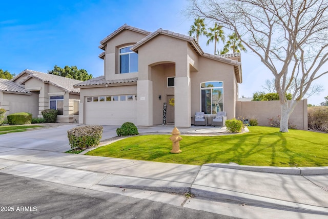 mediterranean / spanish-style house featuring driveway, an attached garage, fence, and stucco siding