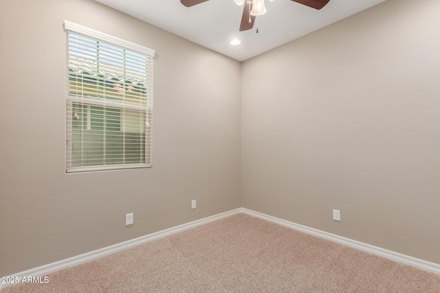 spare room with a ceiling fan, carpet flooring, baseboards, and recessed lighting