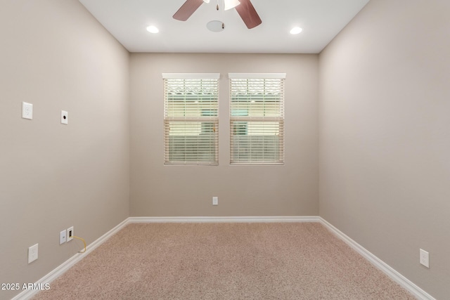 carpeted empty room with ceiling fan, baseboards, and recessed lighting