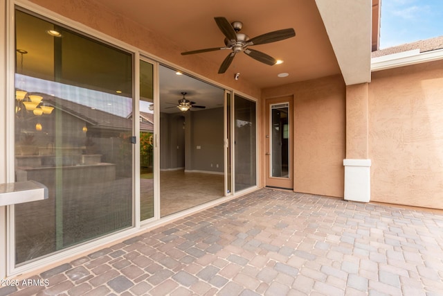 view of patio / terrace featuring ceiling fan