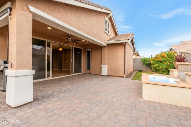 view of patio with ceiling fan and a fenced backyard