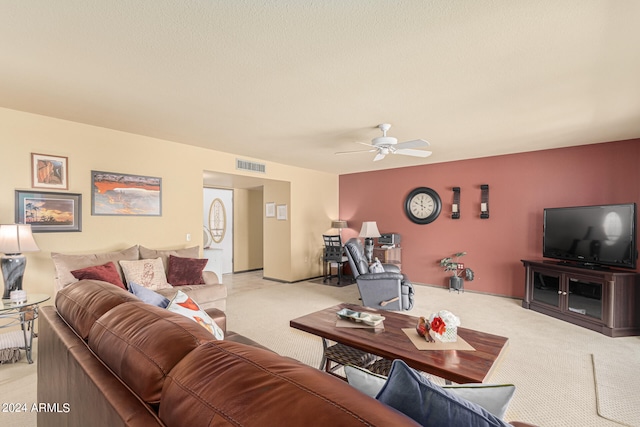 carpeted living room featuring ceiling fan