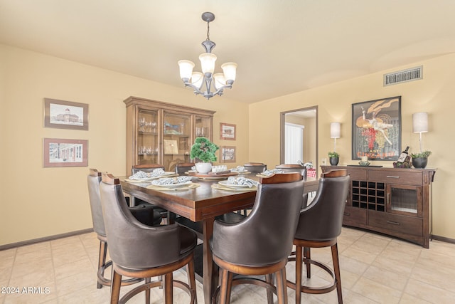 dining space featuring a notable chandelier