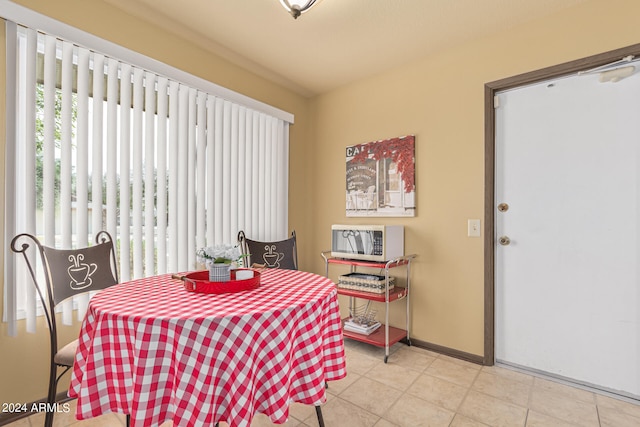 dining area featuring light tile patterned floors